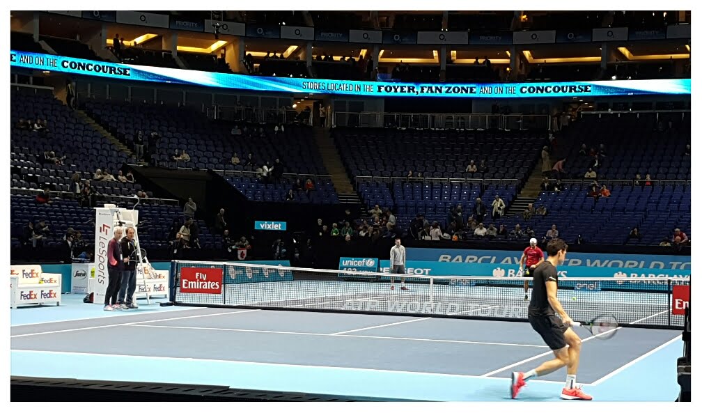 Milos practicing with coach Carlos Moya