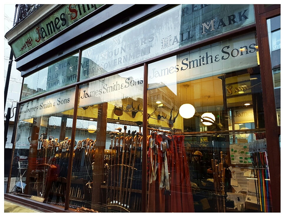 The umbrellas in the window of this shop are 245. That's 245 pounds sterling. Each.